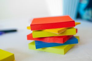 Stack of multi-coloured sticky notes