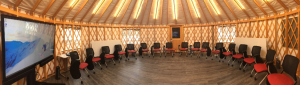 Round shaped classroom space inside of yurt