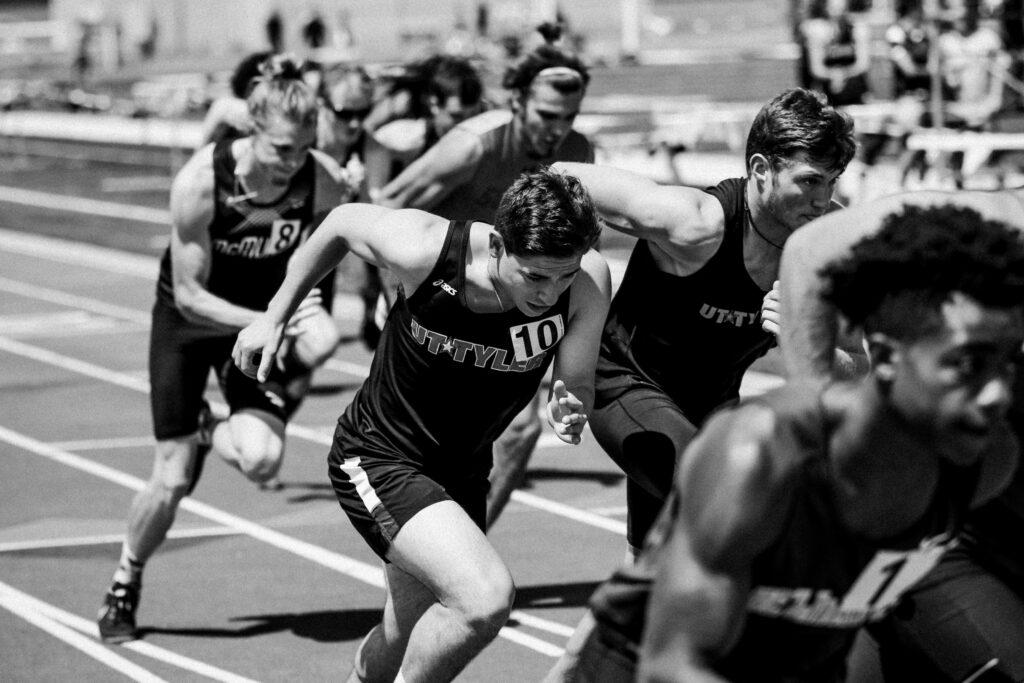 grayscale image of athletes running a race