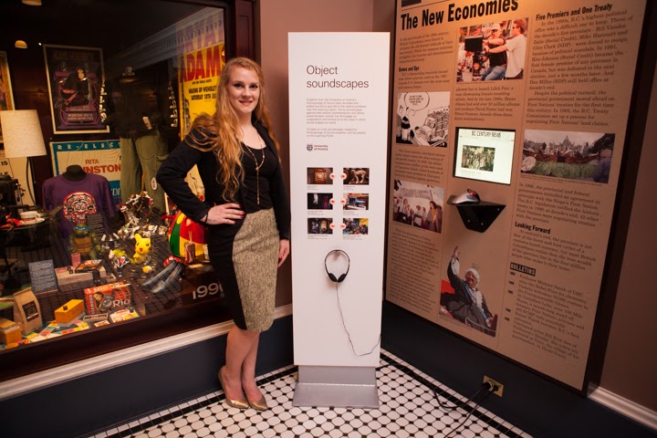 Lydia Toorenburgh stands beside a museum display