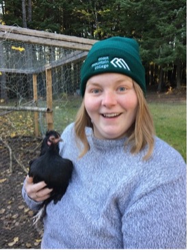 Becca holding a chicken 
